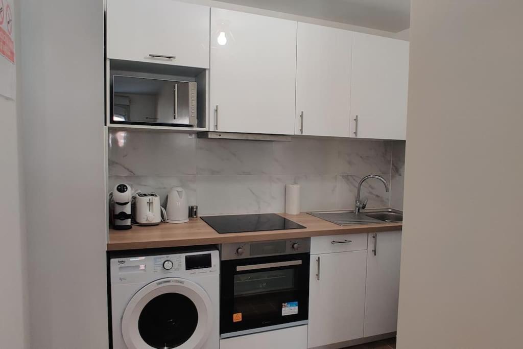 Appart Cosy Auber Porte De Paris โอแบวีลีเย ภายนอก รูปภาพ